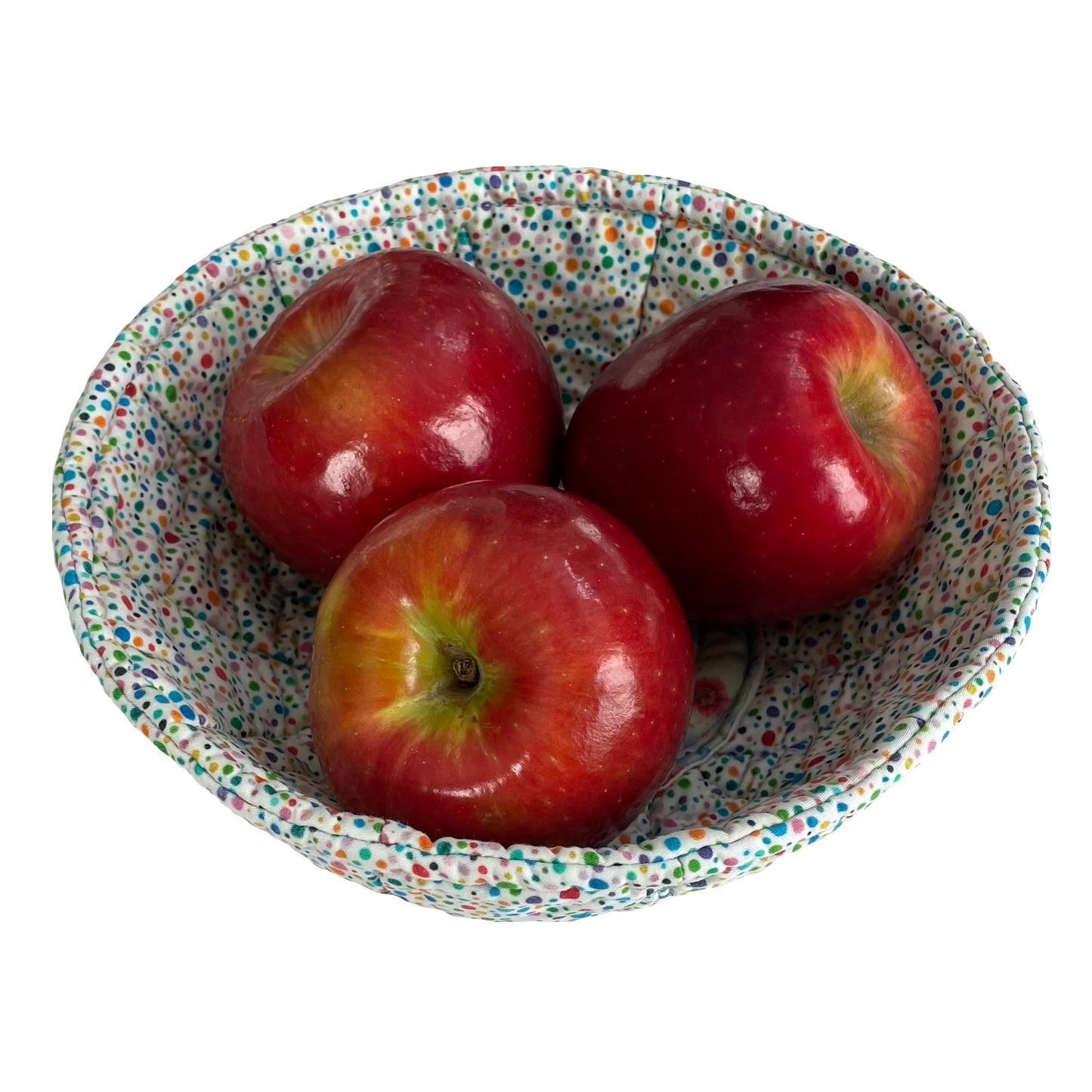 Quilted bowl cozy as fruit bowl containing three apples.