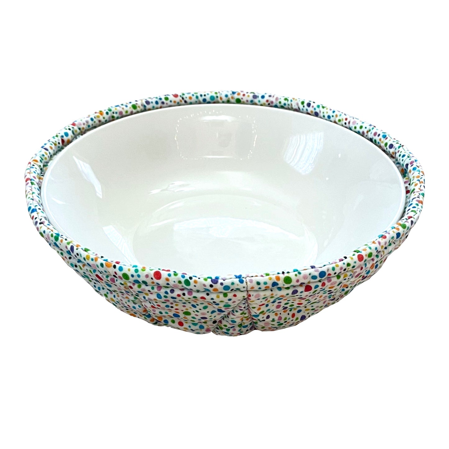 Bowl cozy in rainbow polka dots and floral design with white bowl inside.