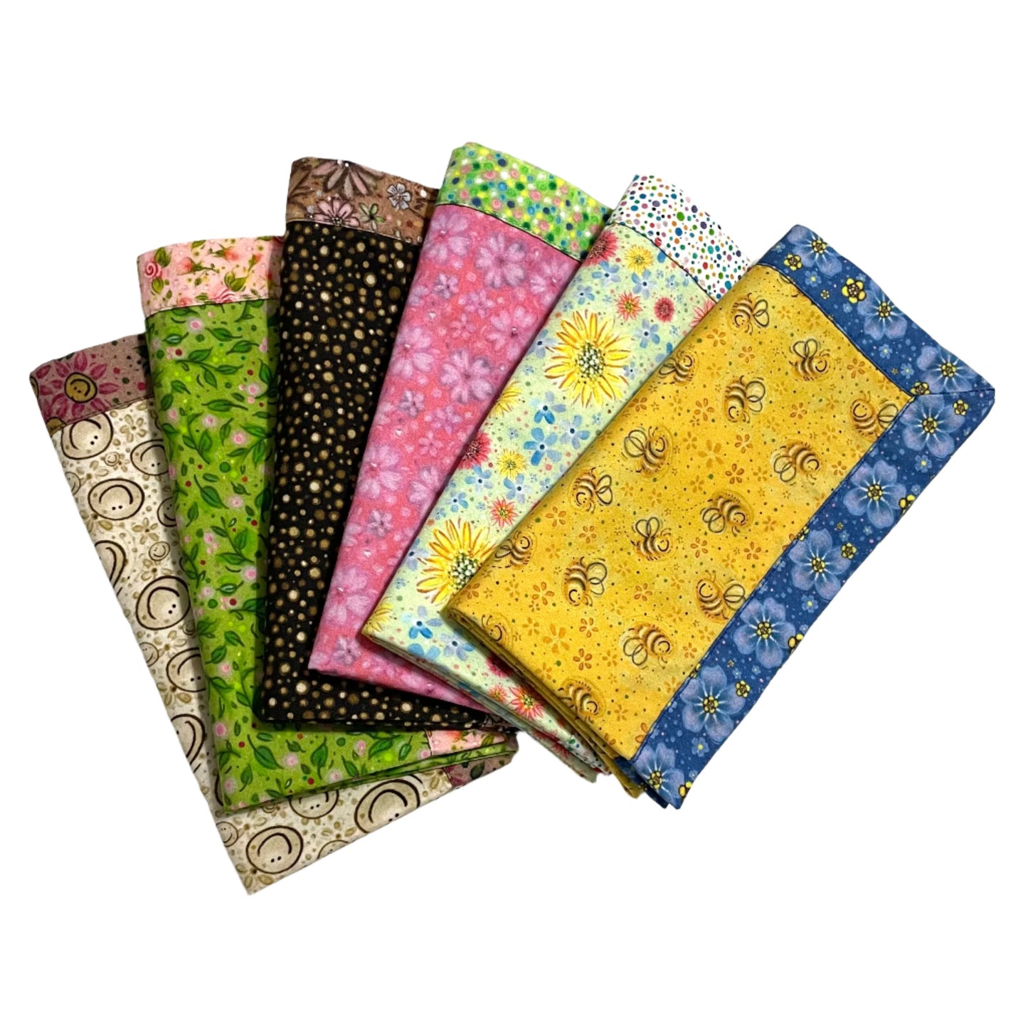 Fan display of 6 reversible 2-color 100% cotton cloth napkins in 6 different color styles.