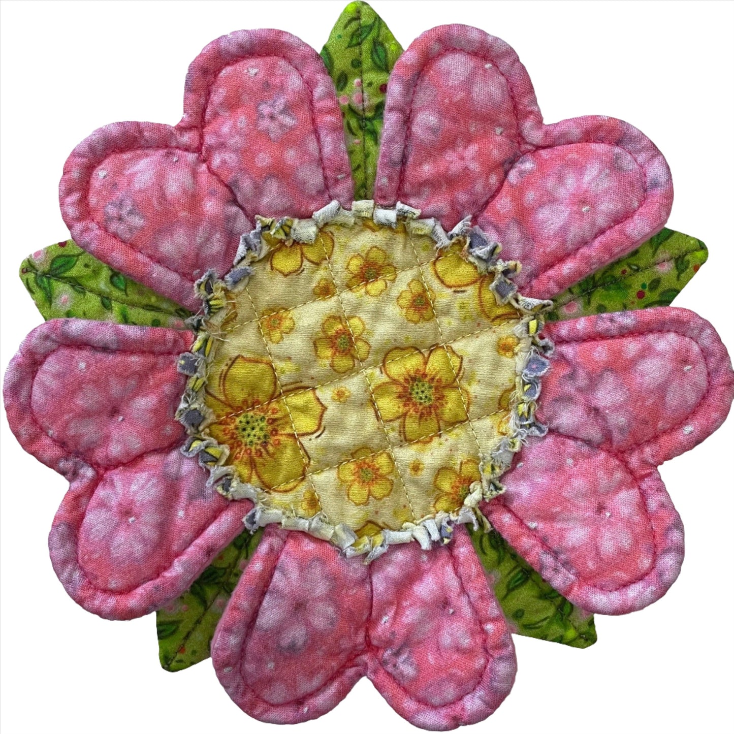Quilted flower mug mat coaster with pink petals, green leaves and yellow center with fringe border.