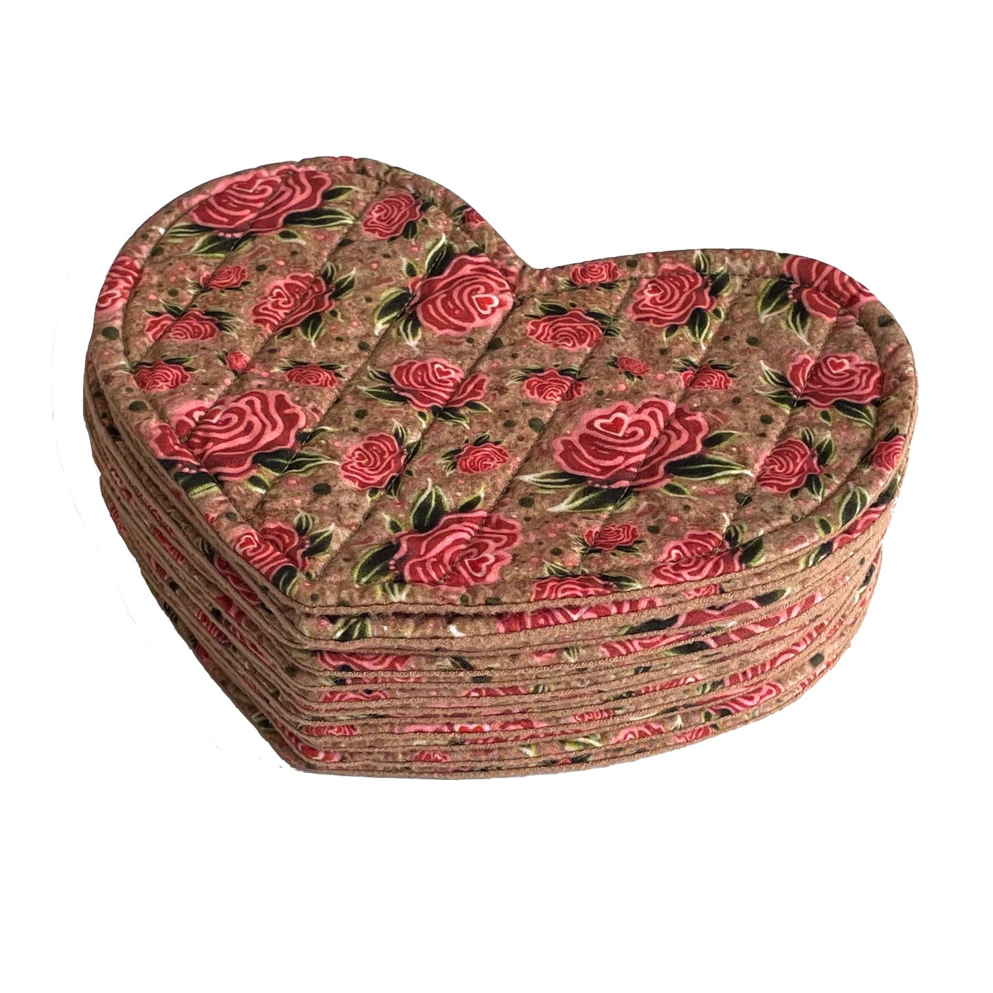 Stack of small quilted mug mats, saucer mats, coasters in red and pink rose design on light brown background.