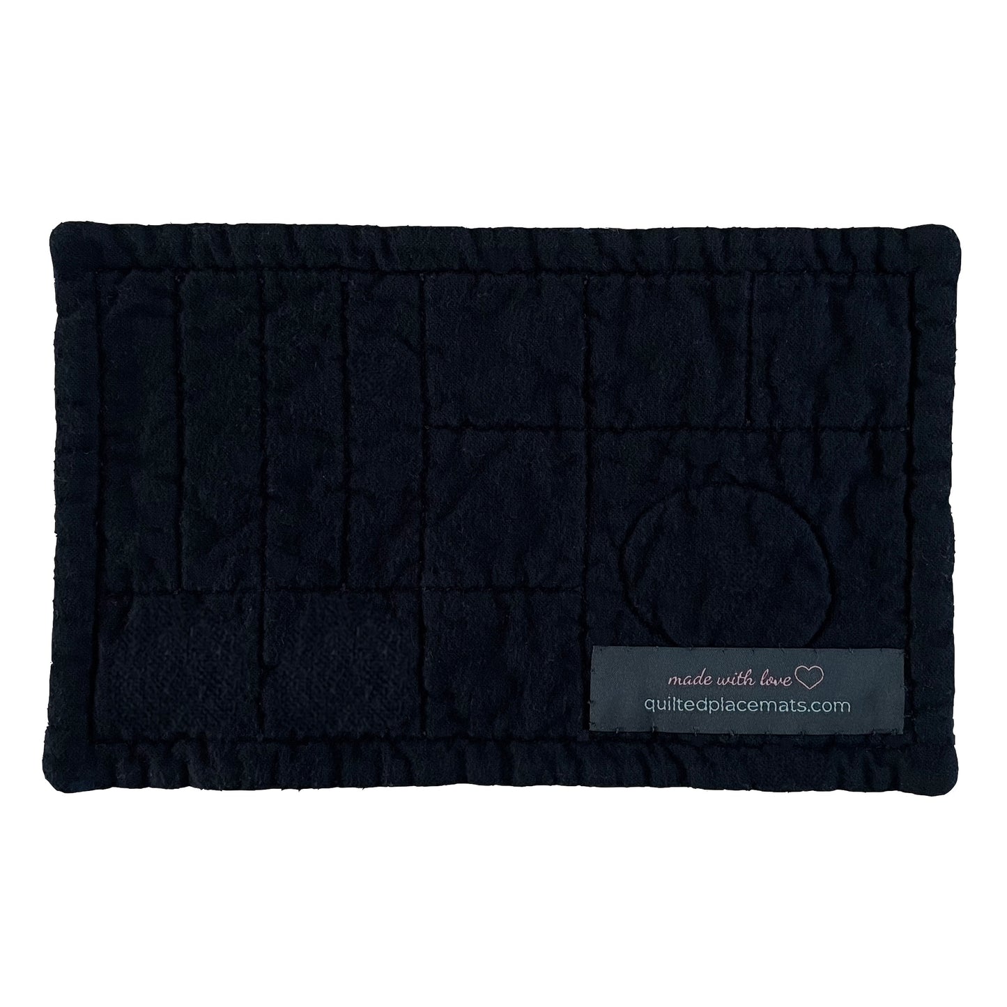 Quilted mug mat, mini mat, snack mat, coaster rectangle back view in black showing label.