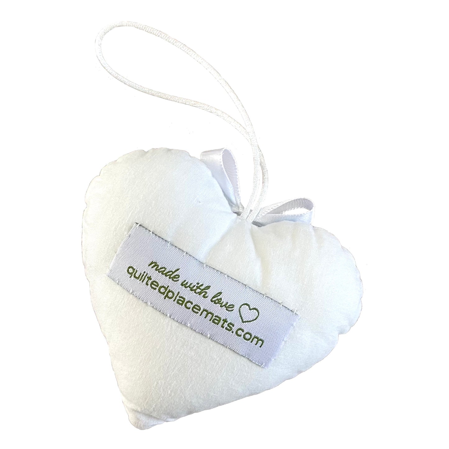 Heart-shaped ornament softy back view in white showing label.