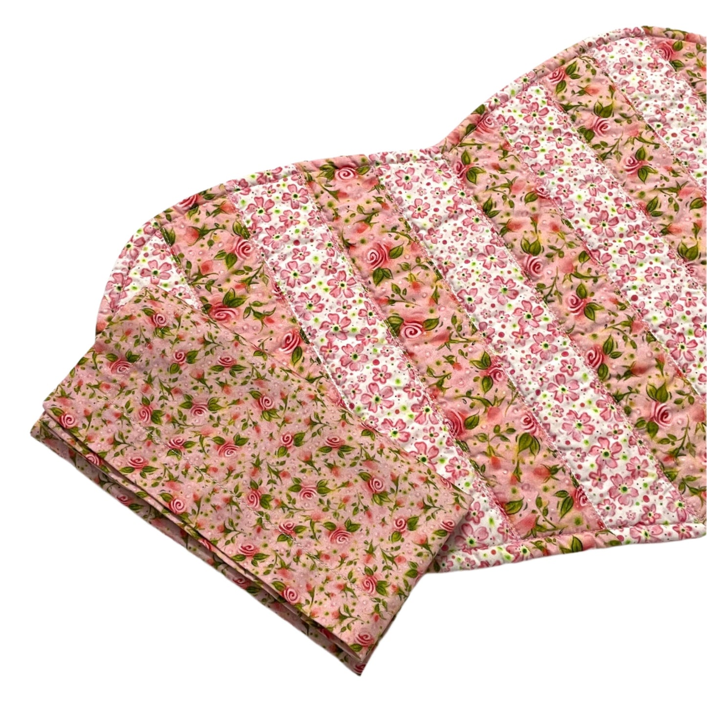 Pink floral striped quilted placemat with matching pink floral cloth napkin.