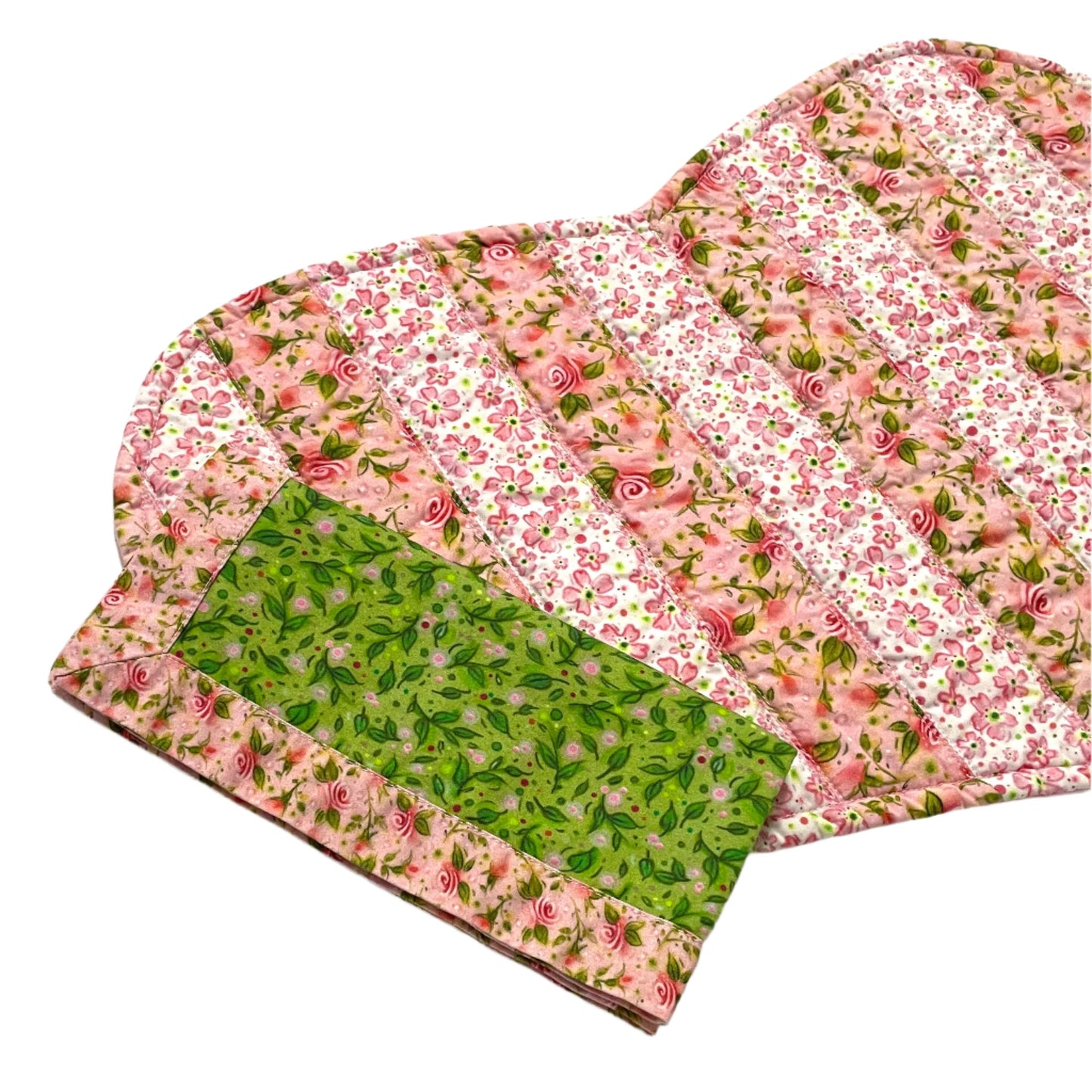 Pink floral striped quilted placemat with matching green and pink floral cloth napkin.